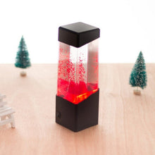 Load image into Gallery viewer, Jellyfish lava lamp, size comparison with hand, desk placement