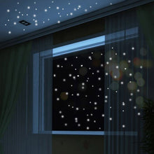Load image into Gallery viewer, Circle glow-in-the-dark stickers, mixed sizes arrangement on wall