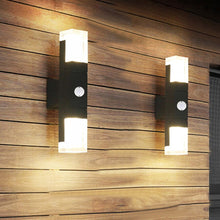 Load image into Gallery viewer, Iguala outdoor LED wall light single head in black aluminium, front view on exterior wall