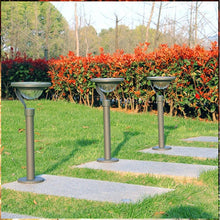 Load image into Gallery viewer, Row of Hidalgo solar bollard lights installed along garden border, illuminated at dusk