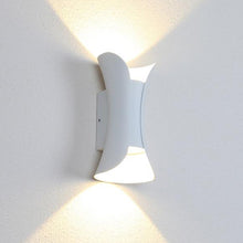 Load image into Gallery viewer, Orizaba 30W outdoor wall light on rendered exterior wall, warm light at dusk