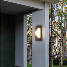 Load image into Gallery viewer, Navojoa Model C outdoor LED wall light, illuminated at night