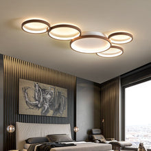 Load image into Gallery viewer, Novas multi-ring LED ceiling pendant, close-up of ring detail, black frame