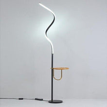 Load image into Gallery viewer, Yumbo floor lamp side profile showing curved iron silhouette and LED light source
