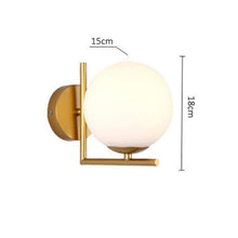 Load image into Gallery viewer, Tierralta LED floor lamp gold frame with 20cm frosted glass ball shade, front view
