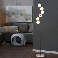 Load image into Gallery viewer, Duitama 6-light LED floor lamp with gold and marble base, front view in living room
