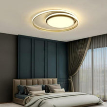 Load image into Gallery viewer, Famalicão LED flush ceiling light illuminated in warm white, room setting
