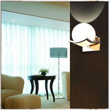 Load image into Gallery viewer, Itacoatiara moon-shaped LED wall light, gold finish, close-up of shape
