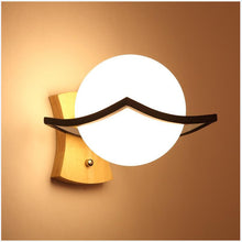 Load image into Gallery viewer, Itacoatiara LED wall light, installed in bedroom, warm white glow
