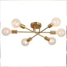 Load image into Gallery viewer, Trancoso LED ceiling light in gold, installed in dining room setting
