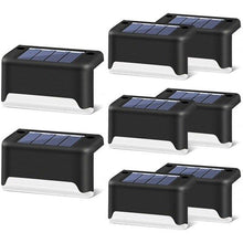 Load image into Gallery viewer, Ciudad Cuauhtémoc solar LED path lights in brown, pack of 2, installed on garden path edge
