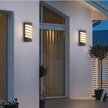 Load image into Gallery viewer, Navojoa cylindrical outdoor LED wall light Model A, black aluminium, front view
