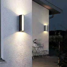 Load image into Gallery viewer, Tulancingo LED wall light close-up showing 3-sided tempered glass diffuser detail
