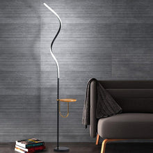 Load image into Gallery viewer, Yumbo Nordic LED floor lamp with curved iron body, H170cm, front view in living room
