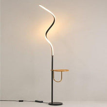 Load image into Gallery viewer, Yumbo Nordic floor lamp illuminated, showing warm white ambient glow
