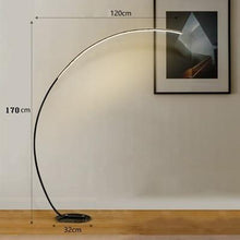 Load image into Gallery viewer, Zipaquirá arc lamp in white positioned over sofa in modern living room
