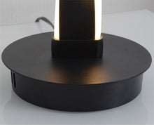Load image into Gallery viewer, Munro floor lamp illuminated, warm white LED glow through spiral form
